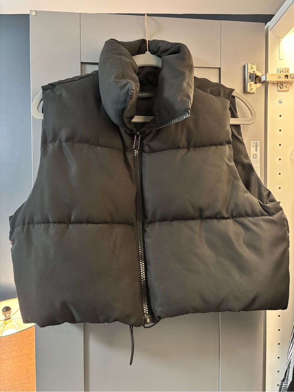 Cropped black puffer vest